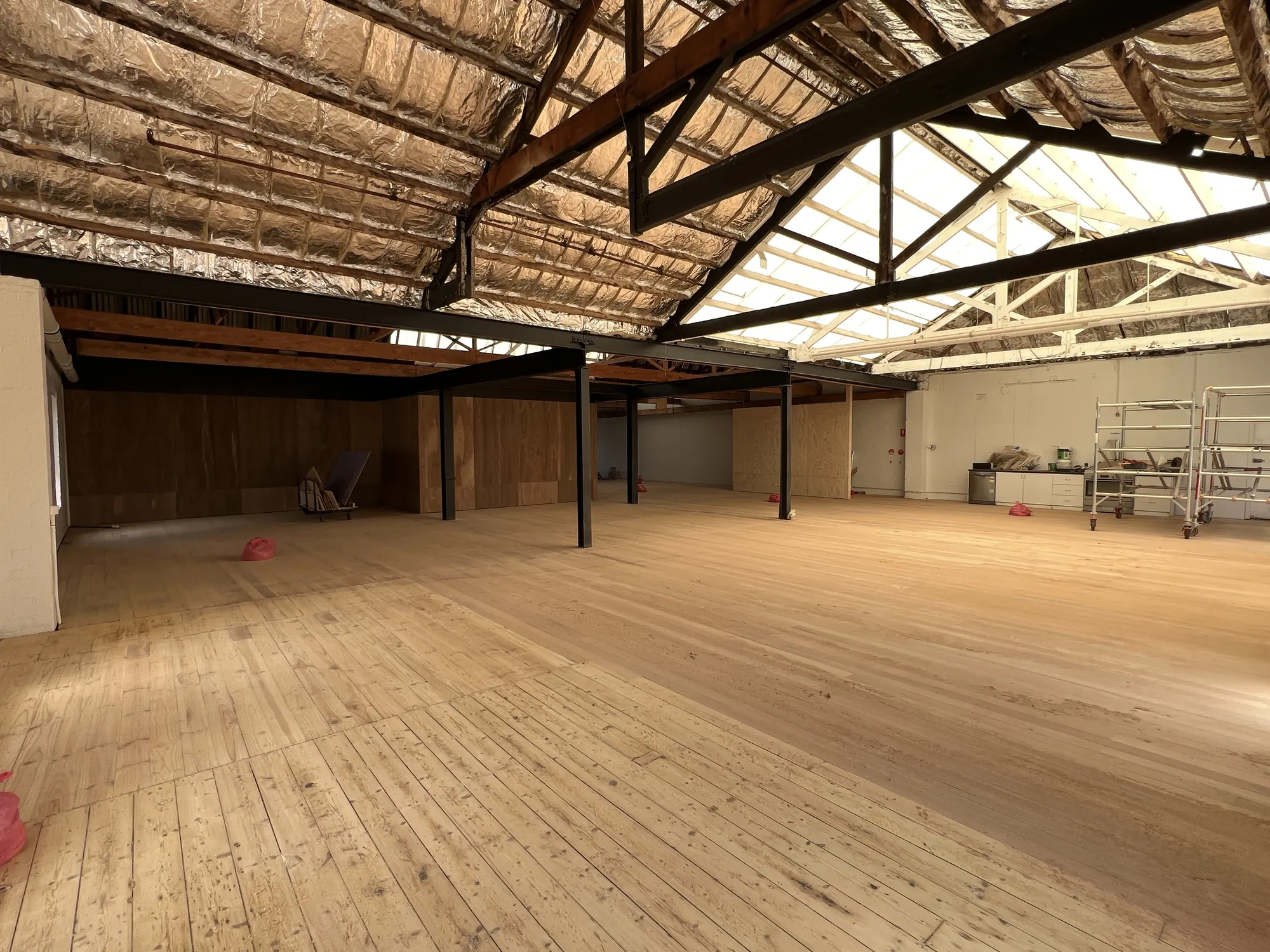 The new hardwood floor laid, before furniture went back in