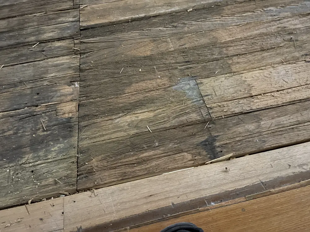 The old boards, worn and split